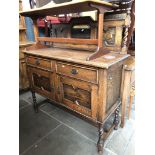 An oak mirror back sideboard.