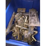 A box of brass door handles