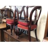 A set of four good quality Victorian mahogany dining chairs with balloon backs and fluted bulbous