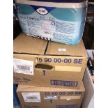 2 boxes of Tena pads.