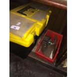 A Stanley toolbox with tools and a small box with jigsaw blades and cutting disks.