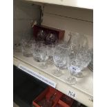 A suite of 18 crystal glasses, a boxed pair of Doulton crystal brandy glasses, jugs etc