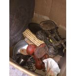 A box of metalware to include 3 sets of kitchen scales, 2 large brass chargers, etc.