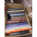 A box containing 10 Folio Society books and 15 volumes of Charles Dickens