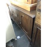 An oak sideboard on cabriole legs