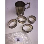 4 silver napkin rings and a plated cup