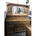 An oak mirror back sideboard.