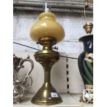 A Victorian brass paraffin lamp with glass funnel & duplex double wick
