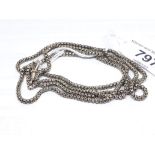 A yellow metal star pierced box link guard chain, length 78cm, unmarked, weight 12.13g.