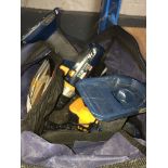 A bag with 2 Ryobi cordless drills complete with batteries and chargers.