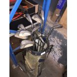 Golf clubs, bag and trolley.