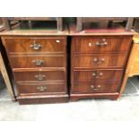 Two reproduction two drawer filing cabinets with leather writing surfaces