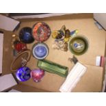 A box with paperweights and Wade ornaments