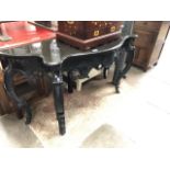 A reproduction ornate console/hall table with granite top.