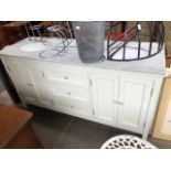 A large double sink vanity unit with marble top.