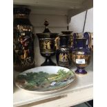 Five Greek style vases and two plates