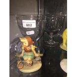A pair of 19th century ale glasses and a Hummel figure