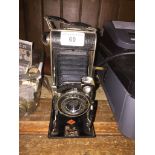 Agfa folding camera with case.