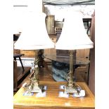 A pair of brass Corinthian column table lamps