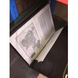 A portfolio case containing old maps and another portfolio case containing some prints.