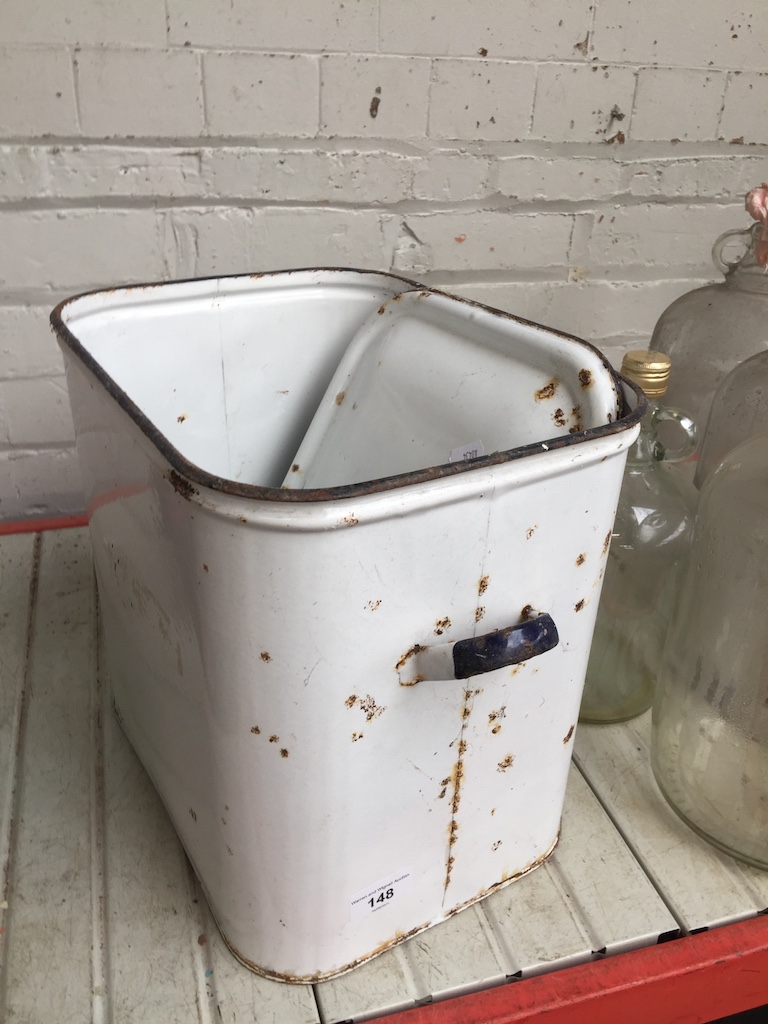 An enameled bread bin with lid.