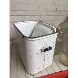 An enameled bread bin with lid.