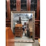 A large ornate framed mirror