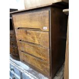 A plywood chest of drawers.