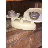 Vintage cream kitchen scales with imperial weights.