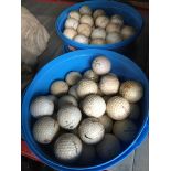 A quantity (2 tubs) of various golf balls
