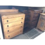 A light oak chest of drawers, together with a reproduction waterfall bookcase and another chest of