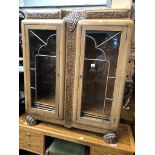 A 1920s/30s Art Deco carved oak glazed bookcase