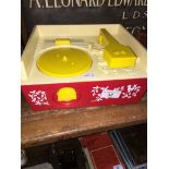 A vintage Fisher Price Music Box Record Player with discs.