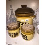 Three stoneware kitchen jars