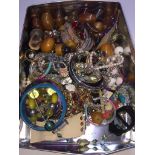 A tin of costume jewellery