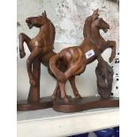 Two wooden horse ornaments