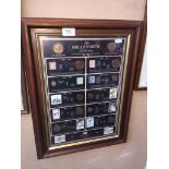 A framed coin collection - 'The Millennium Collection' with certificate of authenticity to rear.