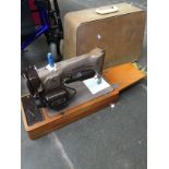A Singer sewing machine EM364984.