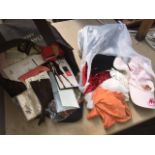 A bag of vintage stockings, suspenders and misc clothing items.