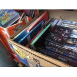 2 boxes of VHS cassettes to include movies, Scooby Doo, etc and a box of DVDs and few books.