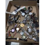 A tray of ladies & gents watches, Timex, Sekonda etc.