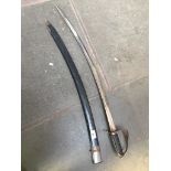 A decorative sabre in black scabbard