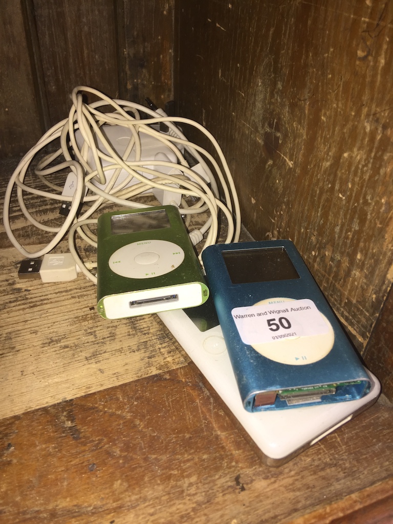 A vintage ipod 20GB and a vintage Ipod 4GB with cables, etc.