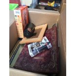 A box of misc to include books, Star Wars watch, Airfix airplane kit, portable radio receiver,