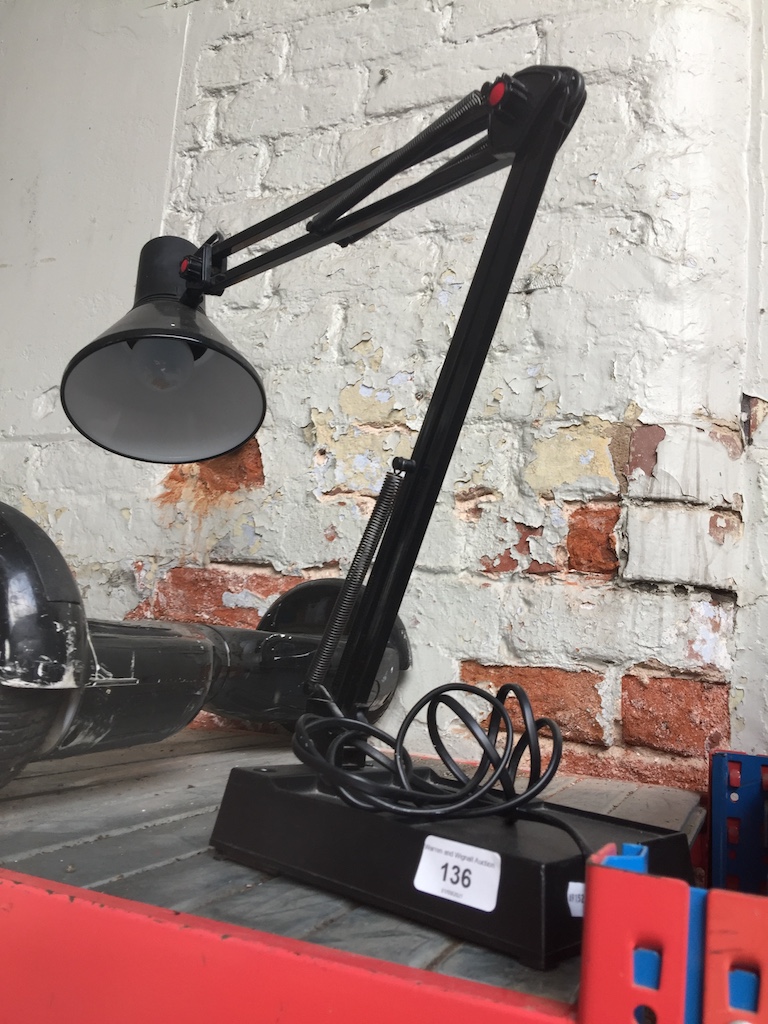 A black anglepoise lamp.