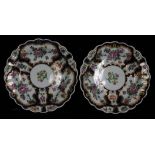 A pair of Worcester porcelain plates, circa 1770, of scalloped formed and decorated with floral