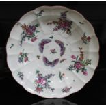 A Worcester porcelain soup plate, circa 1770, of scalloped form and decorated in over enamels with