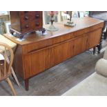 A mid century teak sideboard by Remploy, c.1960s, height 74cm, length 186cm and depth 49cm. Some