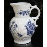 A large Worcester porcelain jug, circa 1765, cabbage leaf moulded with bearded mask spout and shaped