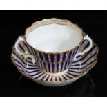 A Worcester porcelain chocolate cup and saucer, circa 1770, of scalloped form and decorated in